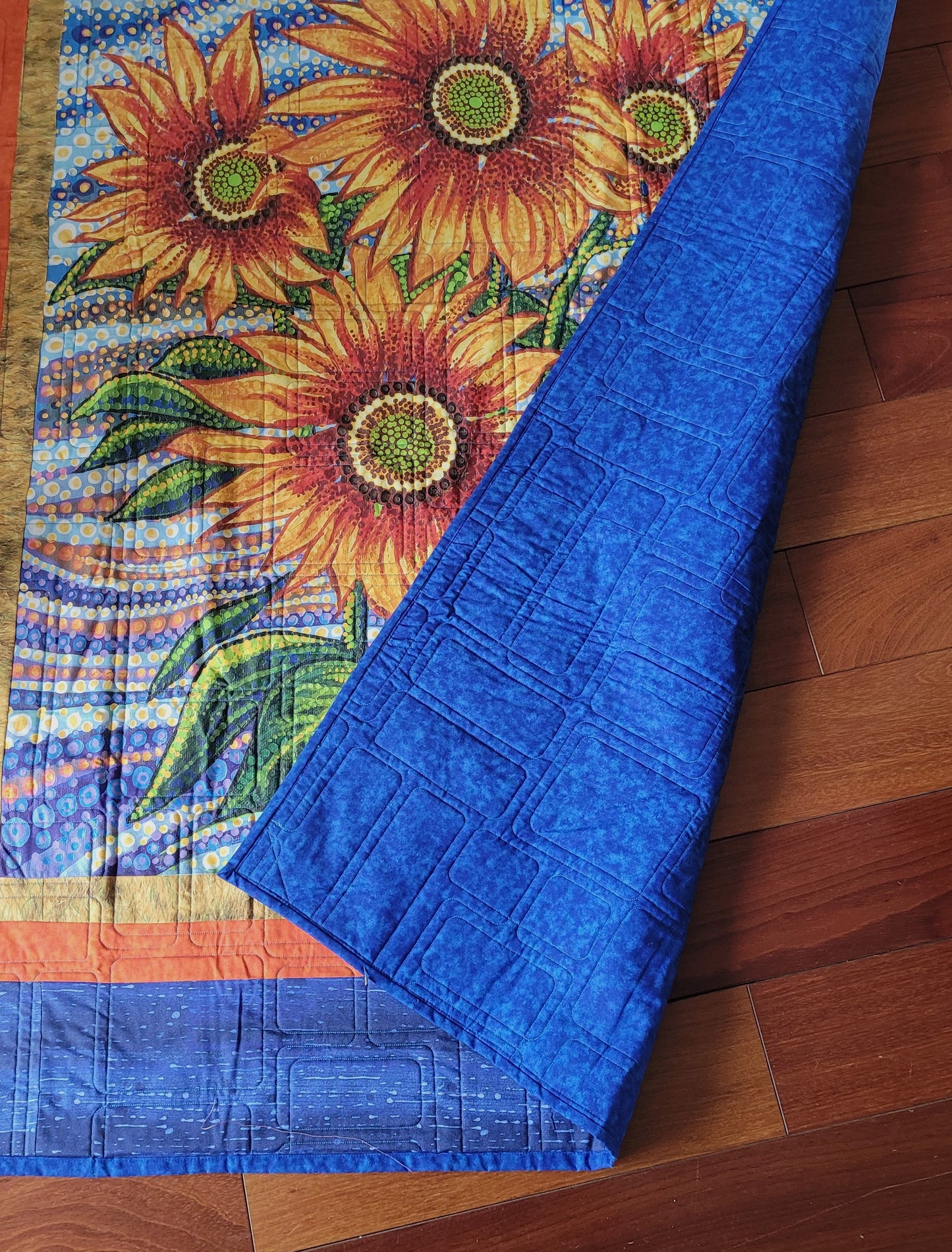 Contemporary Handmade Sunflower / Floral Lap Quilt, Wall Hanging, Bright Orange and Yellow Sunflowers bordered in Blue approx 46 x 60 inches