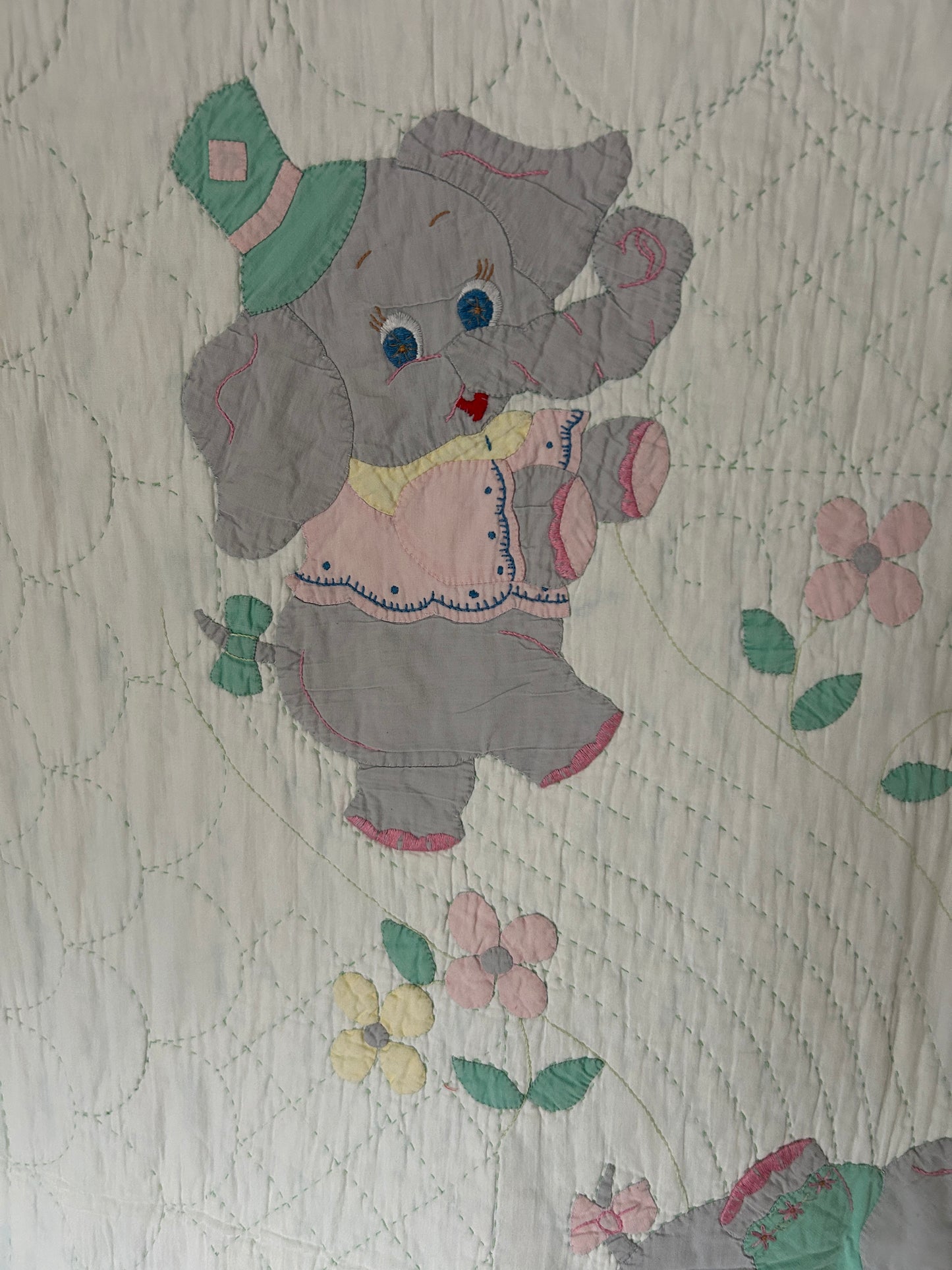 A Vintage 1960s Handmade Quilted Appliqued Embroidered Baby Quilt with Elephants, Flowers, Sun - white / green (52x62)