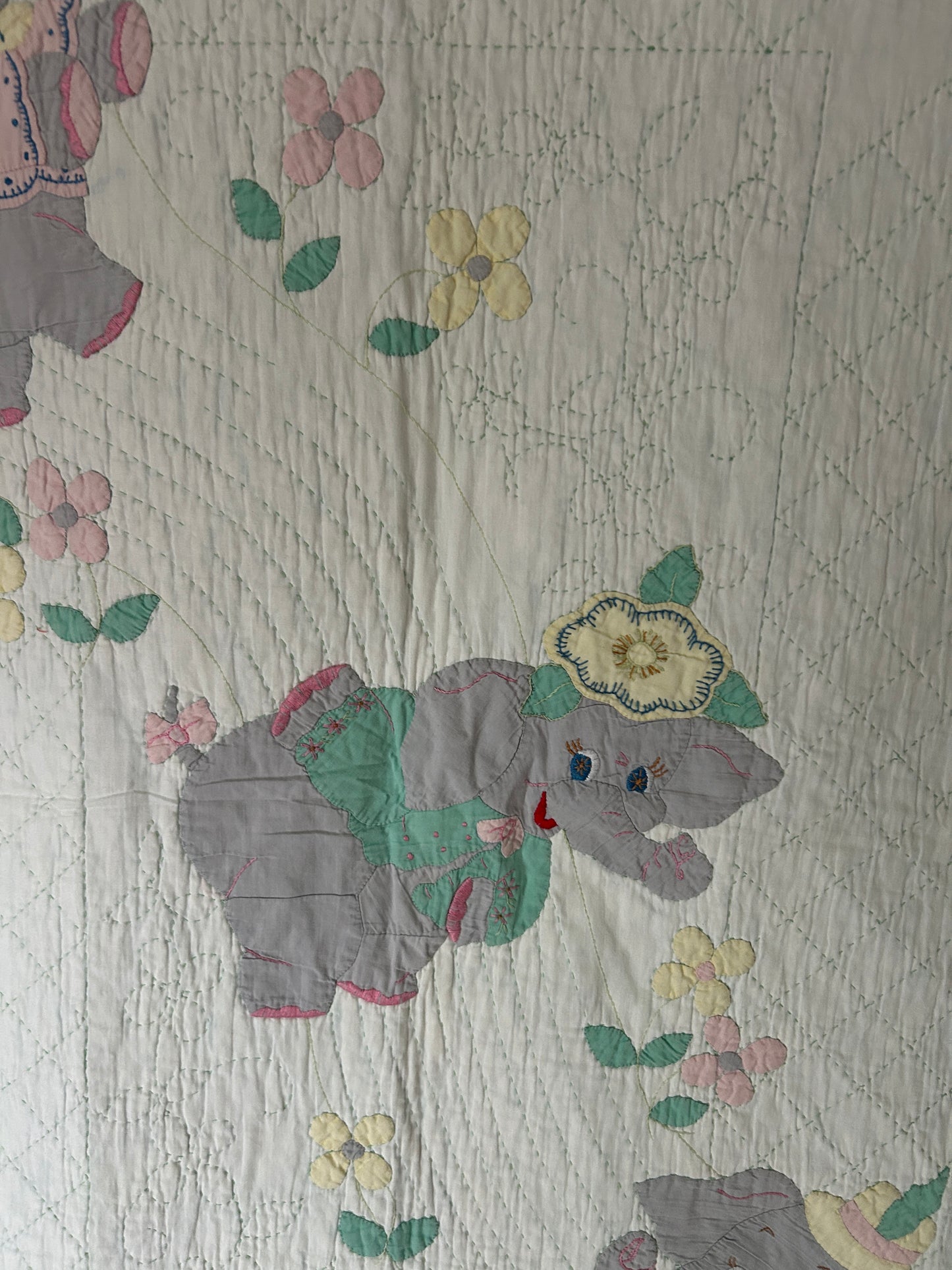 A Vintage 1960s Handmade Quilted Appliqued Embroidered Baby Quilt with Elephants, Flowers, Sun - white / green (52x62)
