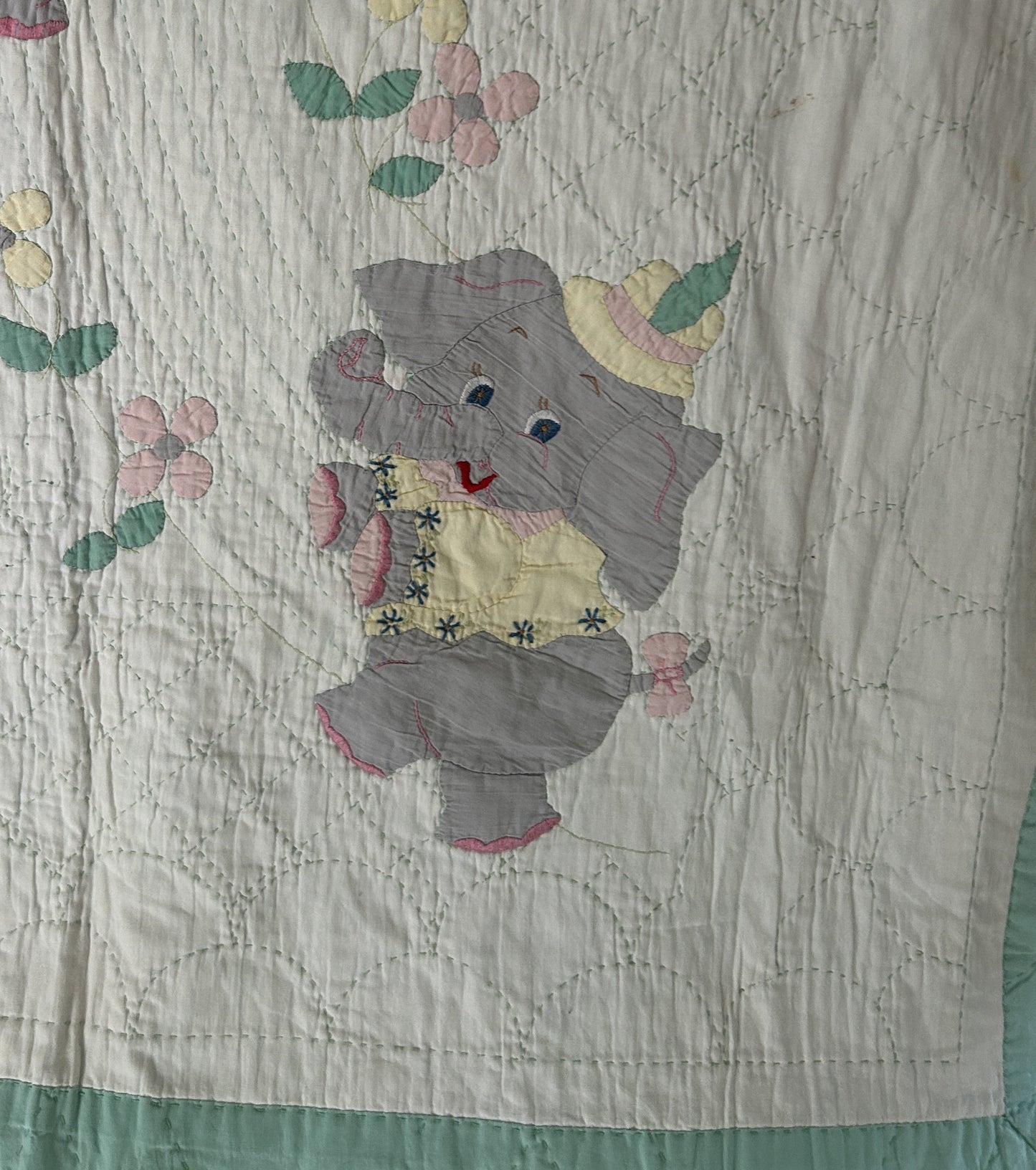 A Vintage 1960s Handmade Quilted Appliqued Embroidered Baby Quilt with Elephants, Flowers, Sun - white / green (52x62)