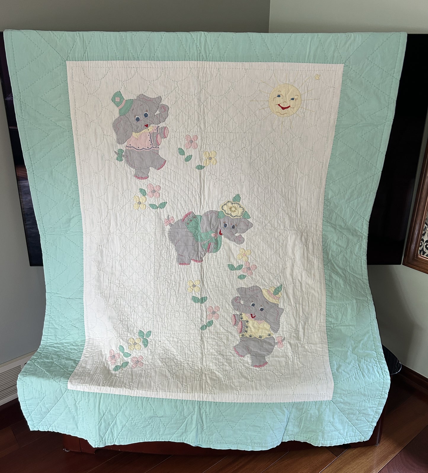 A Vintage 1960s Handmade Quilted Appliqued Embroidered Baby Quilt with Elephants, Flowers, Sun - white / green (52x62)