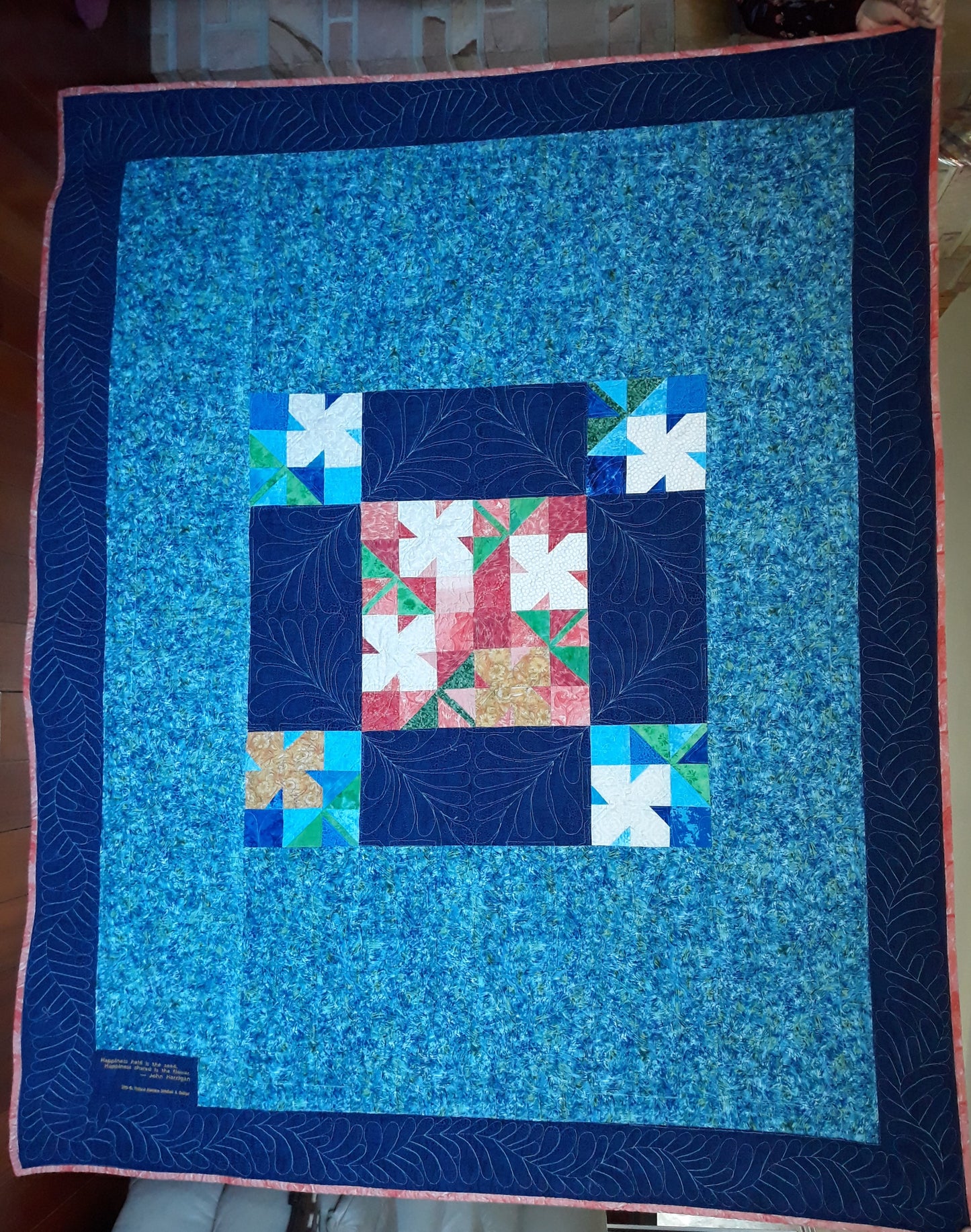 WindBlown Blossoms Quilt 64 x 80 inches, Blue and Coral, two sided quilt, handmade, geometric with colored flowers wooden button centers