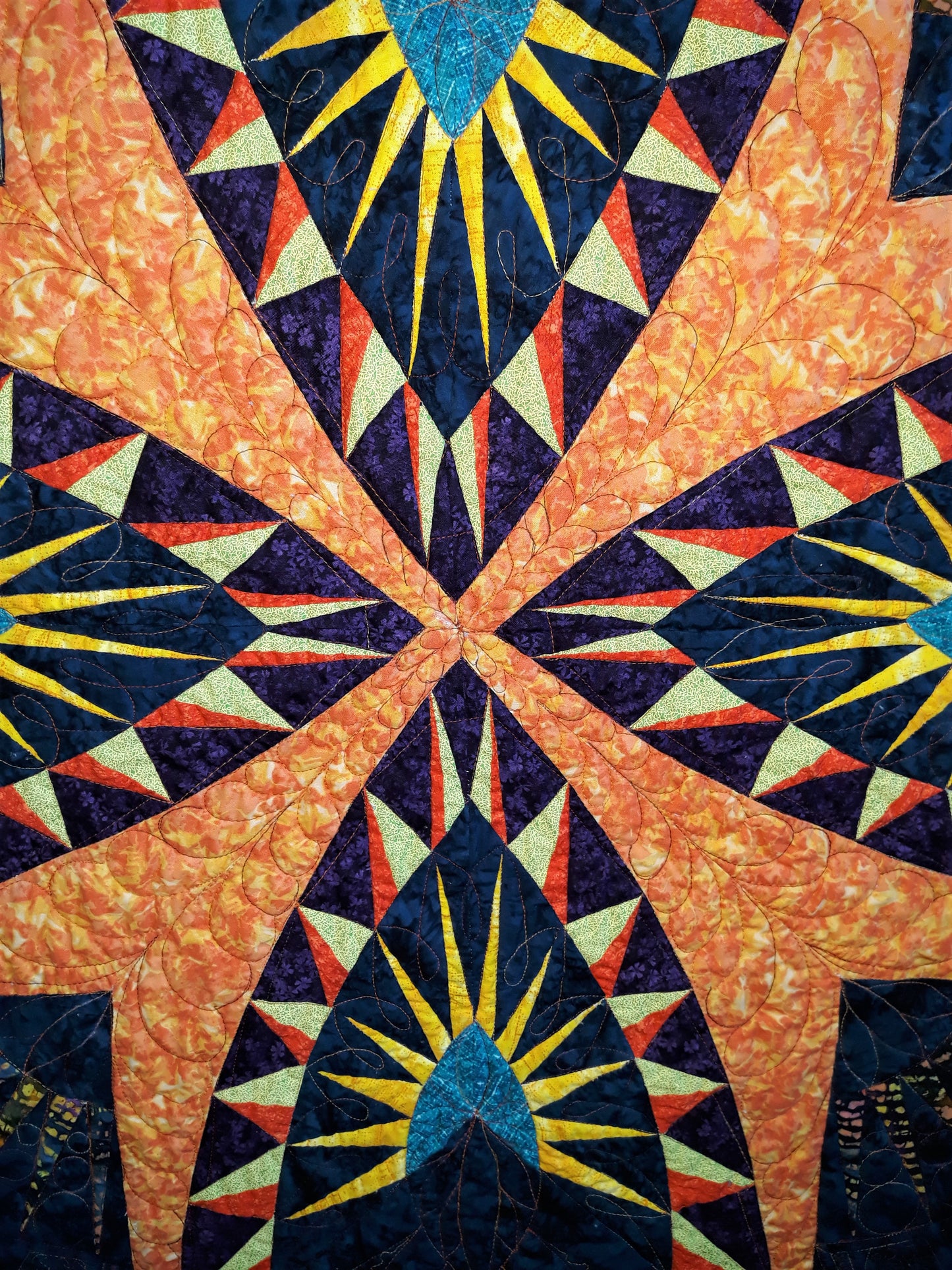 A Spikey Spike Medallion Small Quilt or Wall Hanging, 42 x 42 inches, Bold colors, Geometric design with extensive quilting, teal orange blue yellow