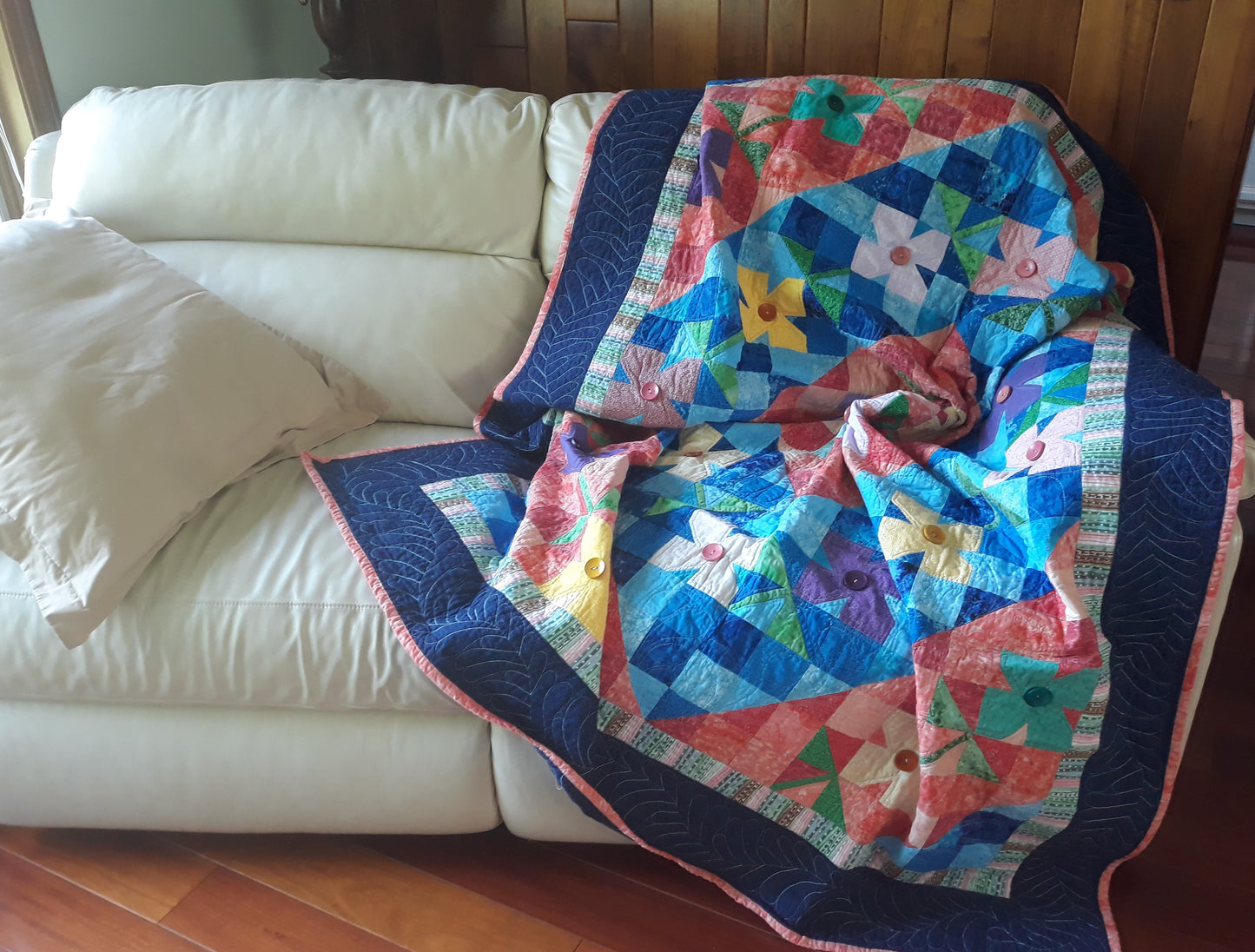 WindBlown Blossoms Quilt 64 x 80 inches, Blue and Coral, two sided quilt, handmade, geometric with colored flowers wooden button centers