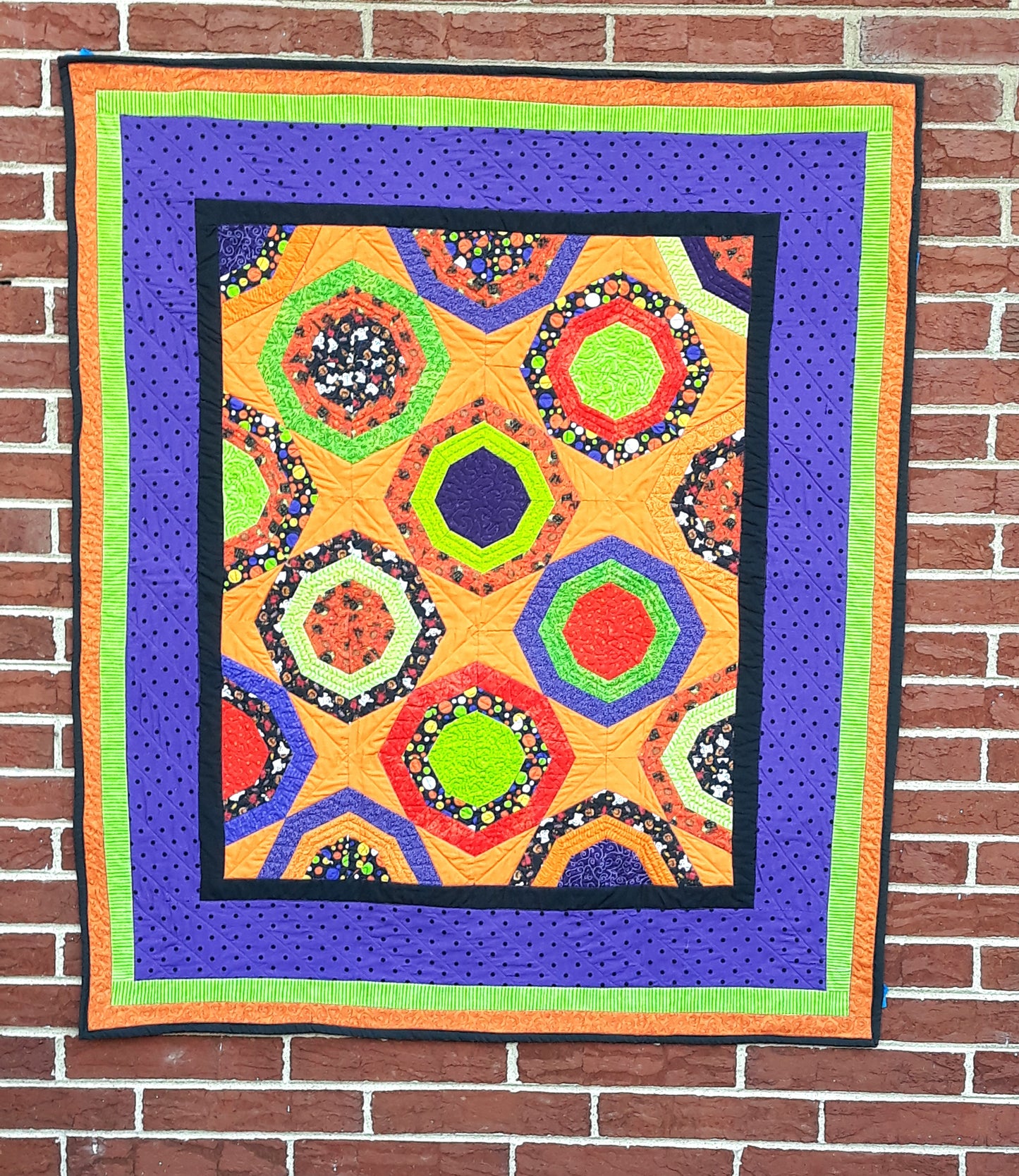 Halloween Fabric Octagon Lap Quilt or Wall hanging, 40 x 48 inches, orange, black, lime green, purple