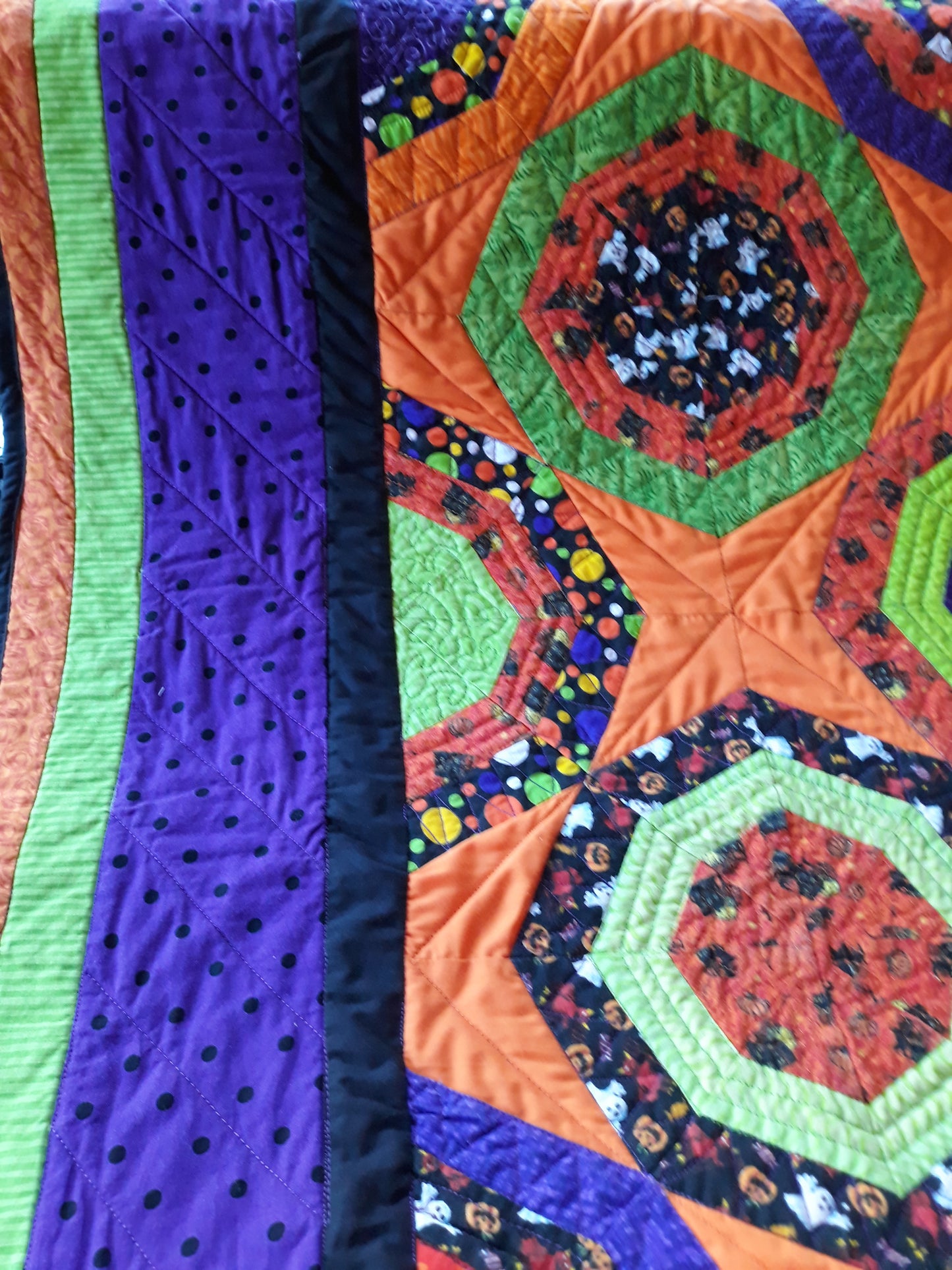 Halloween Fabric Octagon Lap Quilt or Wall hanging, 40 x 48 inches, orange, black, lime green, purple